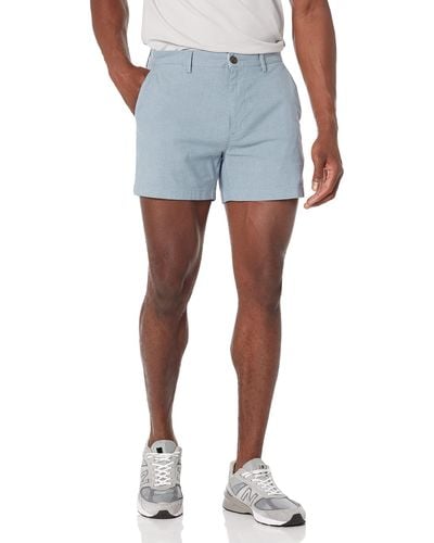Amazon Essentials Pantaloncini in Tessuto Elasticizzato Confortevoli Leggeri da 13 cm vestibilità Aderente Uomo - Blu