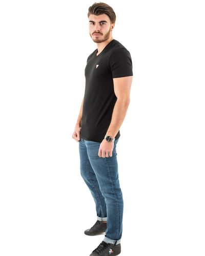 Guess T Shirt en Coton uni Jeans - Noir