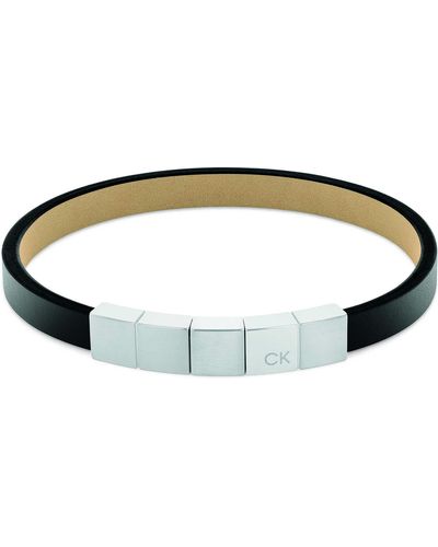 Calvin Klein Armband aus der Architectural-Kollektion. Verstellbares Schmuckstück aus Edelstahl in der Farbe silber und schwarz. - Grün