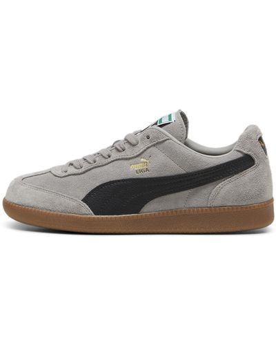 PUMA Erwachsene Liga Suede Sneakers 42.5Concrete Gray Black Gold - Grau