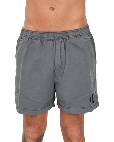 Calvin Klein CK See-Boxer-Swimmingpool-n-Badebekleidung mit gestickten Logo-Taschen und Kordelzug an der Taille Artikel KM0KM00806 - Grau