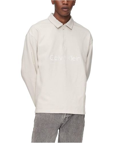 Calvin Klein Relaxed Fit Logo French Terry Long Sleeve Polo Shirt - White
