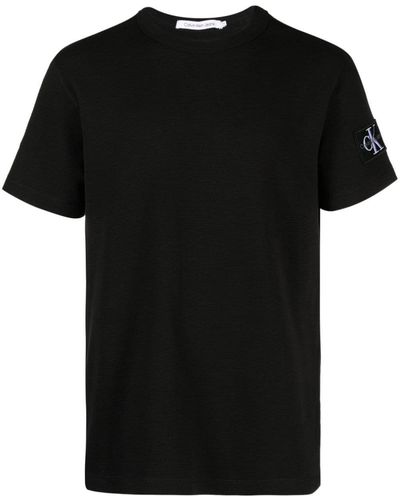 Calvin Klein T-Shirt Kurzarm Badge Waffle Tee Rundhalsausschnitt - Schwarz