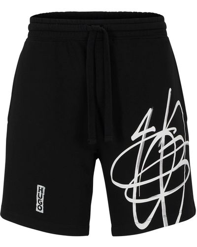 HUGO Relaxed-Fit Shorts aus Baumwolle mit Logo im Graffiti-Stil - Schwarz