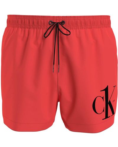 Calvin Klein Costume da Bagno Brand Linea Swimwear CK1 Pantaloncino Laccetti Logo sulla Gamba CK1 Tinta Unita S Arancione