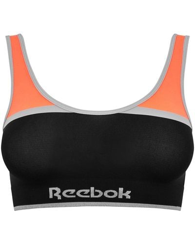 Reebok Naadloze Crop Top In Schwarz/oranje | Unterwäsche Mit Geringer Belastung Und Stretchfunktion Training Bra - Zwart
