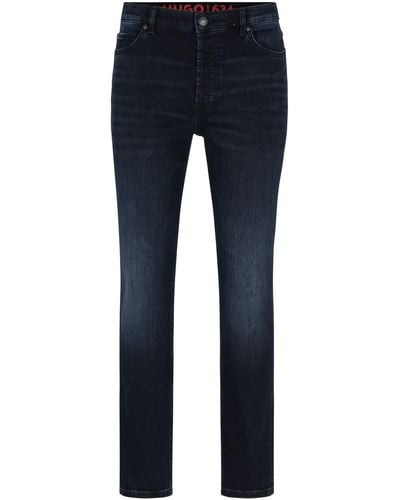 HUGO 634 Tapered-Fit Jeans aus blauschwarzem Stretch-Denim Dunkelblau 32/34