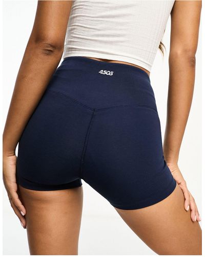 ASOS 4505 Pantalones cortos deportivos con tacto - Azul