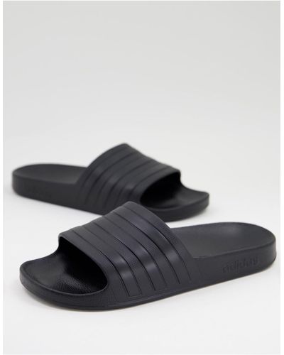 adidas Originals Adidas swim - adilette - sliders nere con strisce bianche - Bianco
