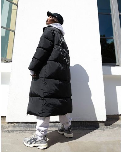 ASOS Asos design weekend collective - cappotto lungo imbottito con grafica sul retro - Nero