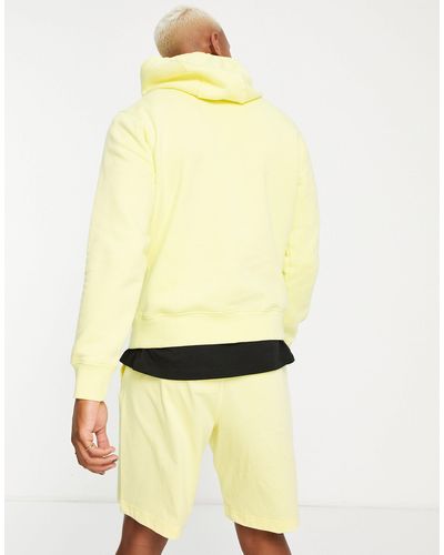 Nike – unisex club – kapuzenpullover aus fleece - Gelb