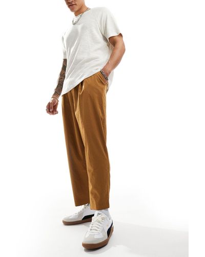Reclaimed (vintage) Pantaloni cropped comodi a fondo ampio marroni - Bianco