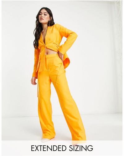 Vero Moda X joann van den herik - pantaloni sartoriali a fondo ampio arancioni - Arancione