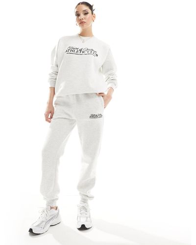 In The Style Joggers grises athletic club de - Blanco
