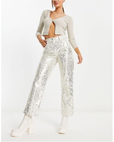 Amy Lynn Lupe - pantaloni metallizzato testurizzati con stampa - Bianco