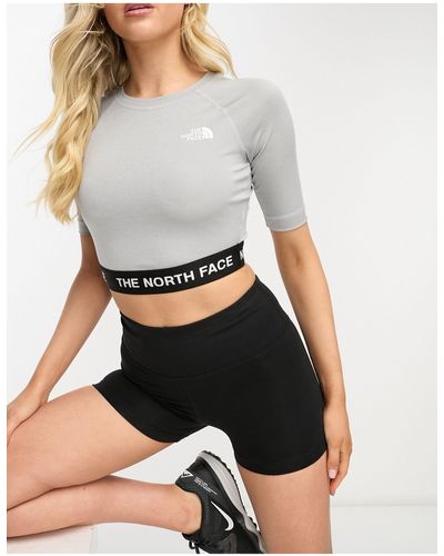 The North Face Training - Cropped Performance Top Met Lange Mouwen - Grijs