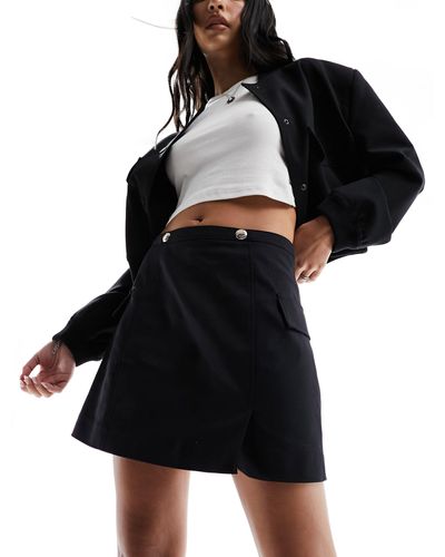 Morgan Mini-jupe trapèze à détails métalliques - Noir