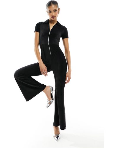 Fashionkilla Tuta jumpsuit nera stretch con allacciatura sul retro e chiusura con zip - Nero