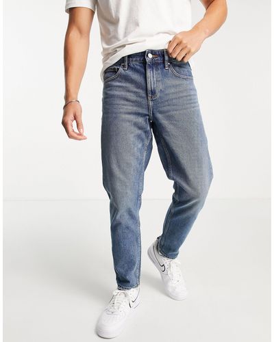 ASOS Klassieke stugge Jeans Met E Vintage Dirty Wash - Blauw