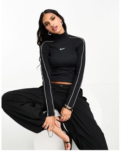 Nike Streetwear - maglietta a maniche lunghe nera con collo a lupetto e righe bianche - Nero