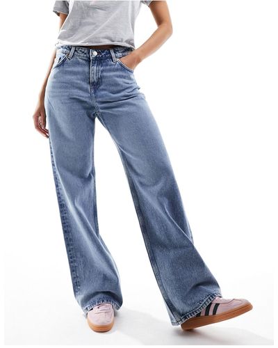 Monki Naoki - jeans ampi a vita bassa lavaggio medio - Blu