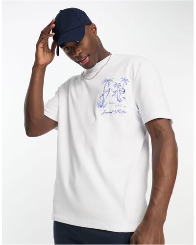 River Island T-shirt écru con stampa di palma sul petto - Bianco