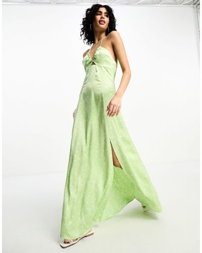 NA-KD X stephsa - robe longue satinée avec découpe sur le devant - imprimé fleurs - Vert