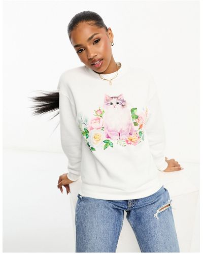 Monki Sweat à encolure ronde, manches longues et imprimé fleuri avec chaton - Blanc