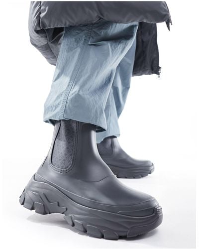 ASOS Stivali da pioggia antracite con stampa di monogramma e suola spessa - Blu