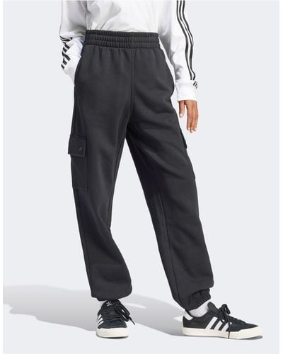 adidas Originals – essentials – cargo-jogginghose aus em fleece - Schwarz