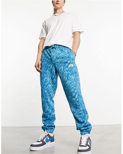 The North Face – essential – oversize-jogginghose mit em marmormuster, exklusiv bei asos - Blau