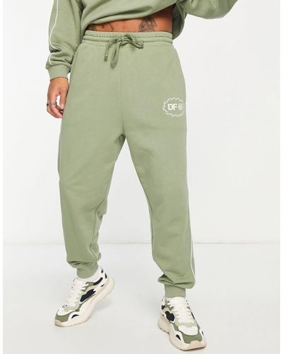 ASOS Asos Dark Future Co-ord Relaxed joggers With V-neck And Piping - Green