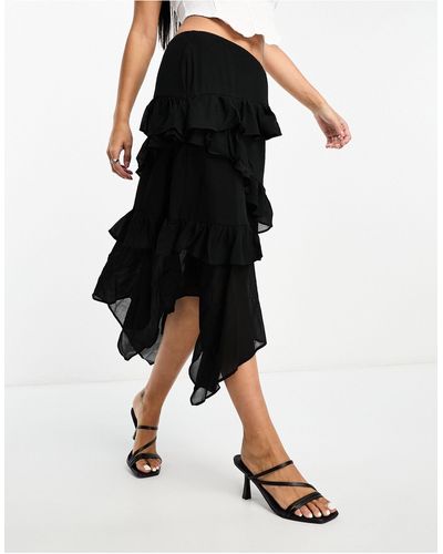 Glamorous Jupe mi-longue volantée en mousseline avec ourlet asymétrique - noir