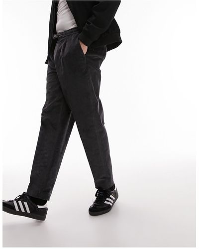 TOPMAN Pantalon fuselé en velours côtelé avec taille élastique - anthracite - Noir