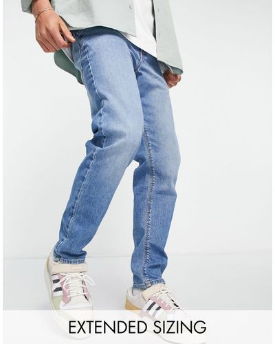 ASOS Toelopende Jeans Met Stretch - Blauw