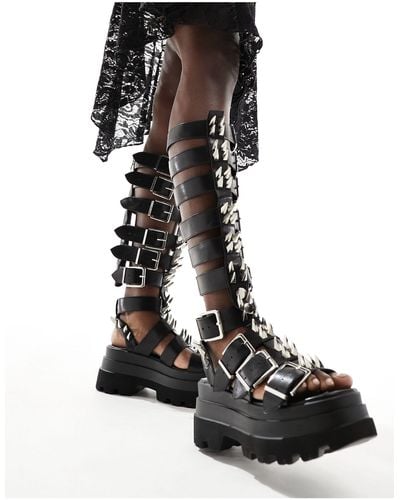 Koi Footwear Koi The Mage Resistor Spiked Gladiator Sandals - Black