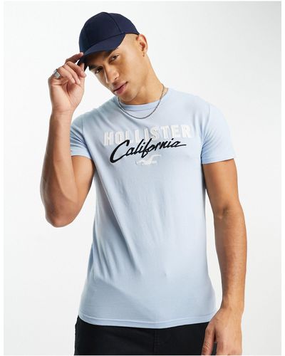 Hollister T-shirt tecnica azzurra con logo - Bianco