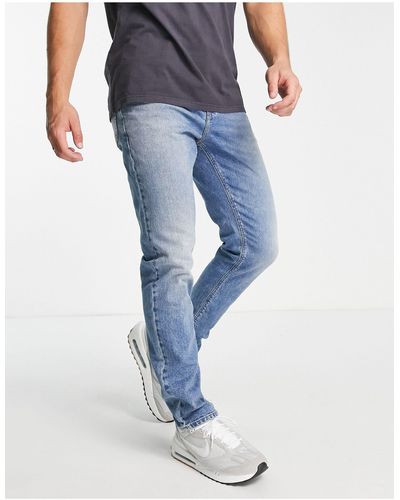 ASOS Jeans slim elasticizzati vintage lavaggio medio - Blu
