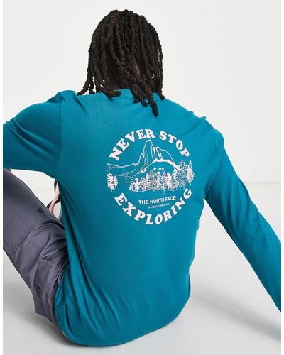 The North Face Exploring circle - t-shirt manches longues imprimé au dos - bleu sarcelle - exclusivité asos