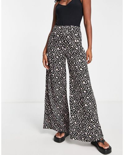 SELECTED Femme - pantalon large à fleurs - Noir