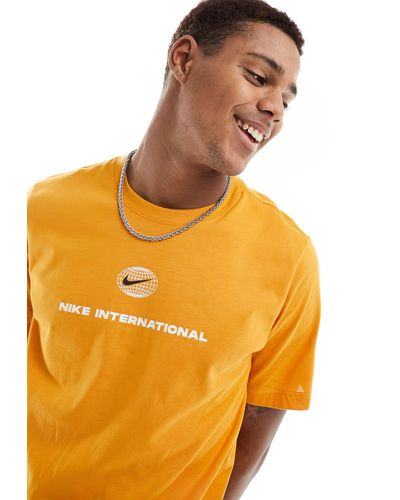 Nike Heritage - t-shirt en tissu dri-fit - orange