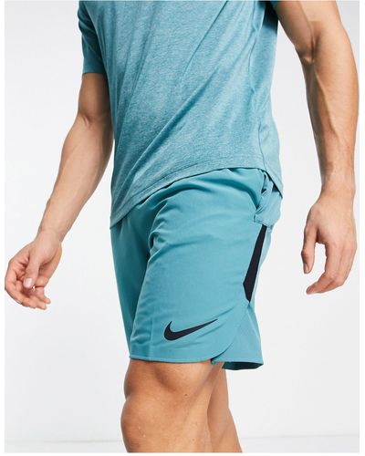 Nike Pantalones cortos color cerceta flex rep - Azul
