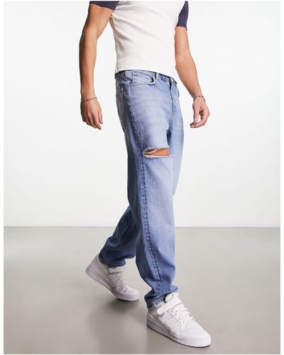 ASOS Jeans larghi con strappi lavaggio medio - Blu