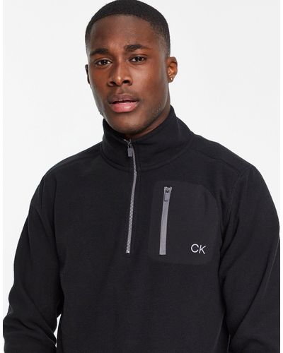 Calvin Klein Planet - Fleece-top Met 1/4 Rits En Nylon Opgestikte Zak - Zwart