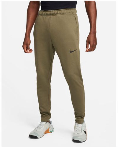 Nike – dri-fit – schmal zulaufende fleece-jogginghose - Grün