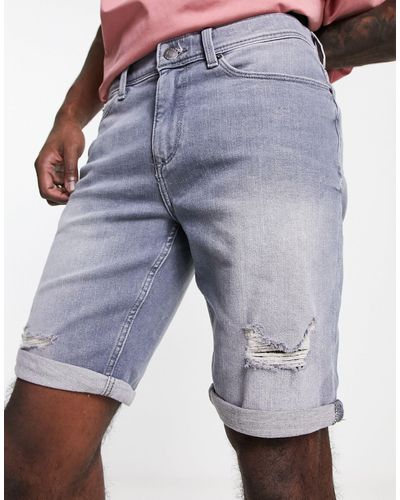 River Island Pantalones cortos vaqueros es entallados con diseño rasgado - Azul