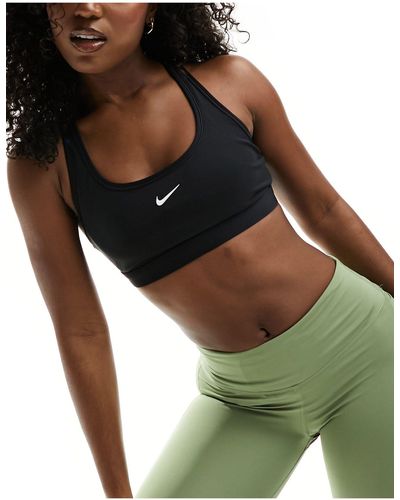 Nike Reggiseno sportivo a sostegno leggero con logo nike - Verde