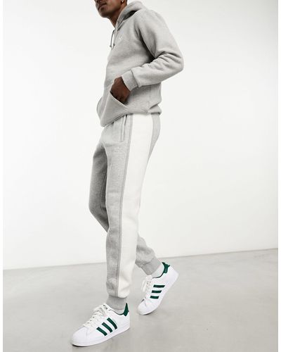 adidas Originals Essentials+ Small Logo Cut And Sew Trackies - White