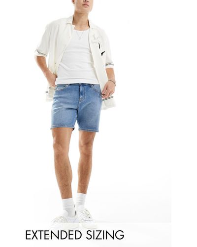 ASOS Short en jean coupe skinny mi-longue - moyen délavé - Bleu