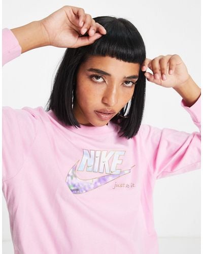 Nike T-shirt a maniche lunghe con logo luccicante - Rosa